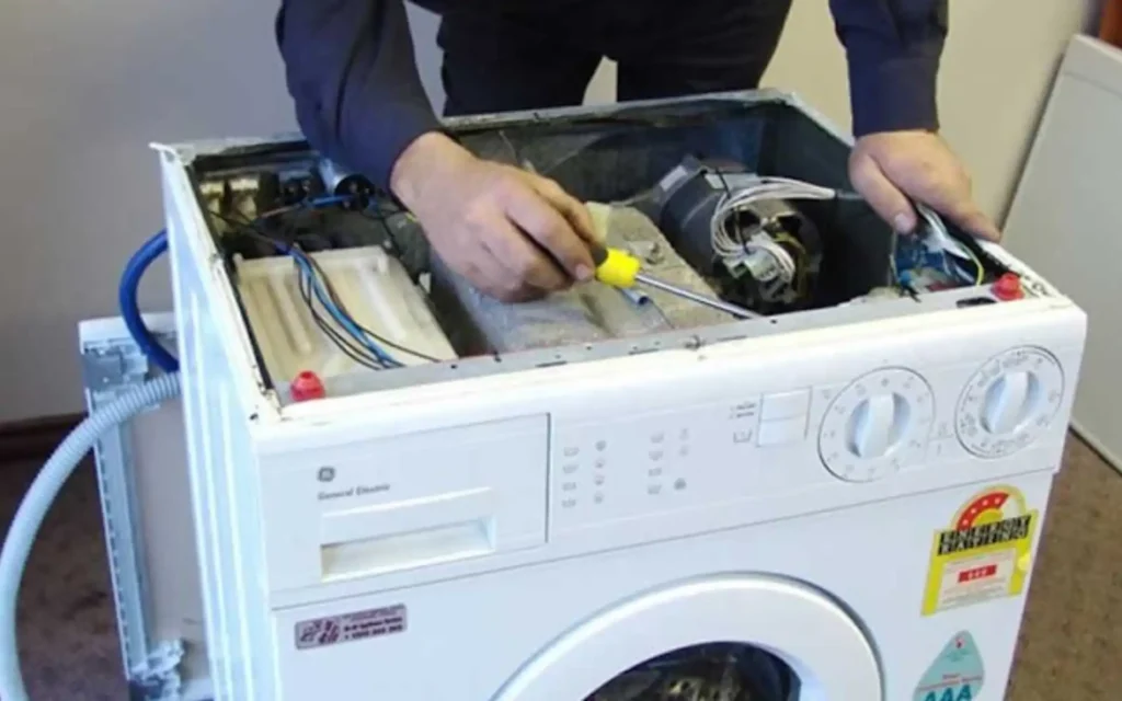 Technician fixing a faulty washing machine in Cape Town